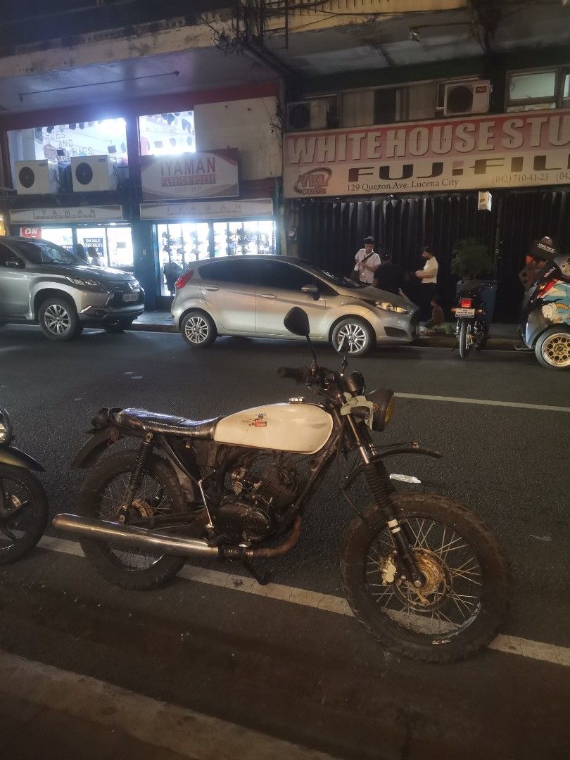yamaha 100 2troke (Category: Motorbikes for Sale) located in Lucena. Submitted by ziboldawg (Listing ID 1470788436, Image 1). Description: > *YAMAHA 100 RS100 SCRAMBLER BUILD - > > Lucena City Area > > Details: > ✅ Umaandar, good engine > ✅ Naka Scrambler setup na (gulong, upuan, tanke) > ✅ Original OR, Original Plate / Plate number > ✅ Xerox CR (nawala orig pero may orig OR) > > Issue: > ❌ Walang ilaw (wiring lang) > ❌ Sira neutral light / neutr