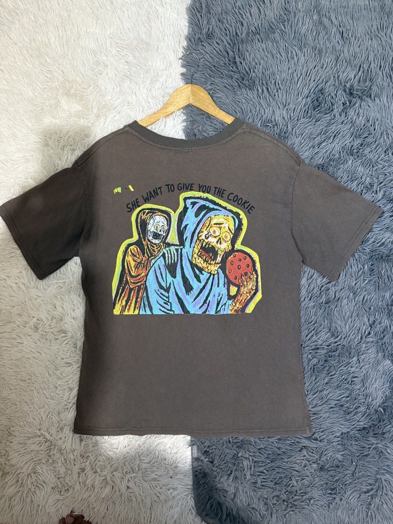 Yeezy x XXXTentacion Hold the Gate (Category: Tshirts & Polo Shirts ) located in Manila. Submitted by keepercollection (Listing ID 1470830713, Image 2). Description: - Brand: HLUT - Size: Medium - Color: Brown - Design: Bold skull, gateway, and reaper graphics with "WHEN I'M ON THE WAY HOLD THE GATE" and "SHE WANT TO GIVE YOU THE COOKIE" text - Fit: Short sleeves, standard crew neck - Condition: Minor cracking on screen print (refer to close-up p