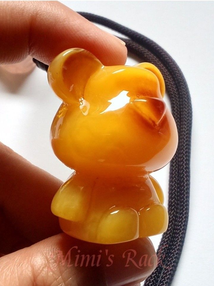 Yellow Amber Bear Carving Rope Necklace (Category: Necklaces) located in Taguig. Submitted by mimisrack (Listing ID 1470901671, Image 3). Description: 💛🍀 Good Luck & Fortune — yellow amber is traditionally associated with blessings, favorable opportunities, and positive outcomes. 💰 Wealth & Abundance — its golden-yellow color symbolizes prosperity, success, and financial growth. 🛡️ Protection & Security — amber is traditionally regarded as a 