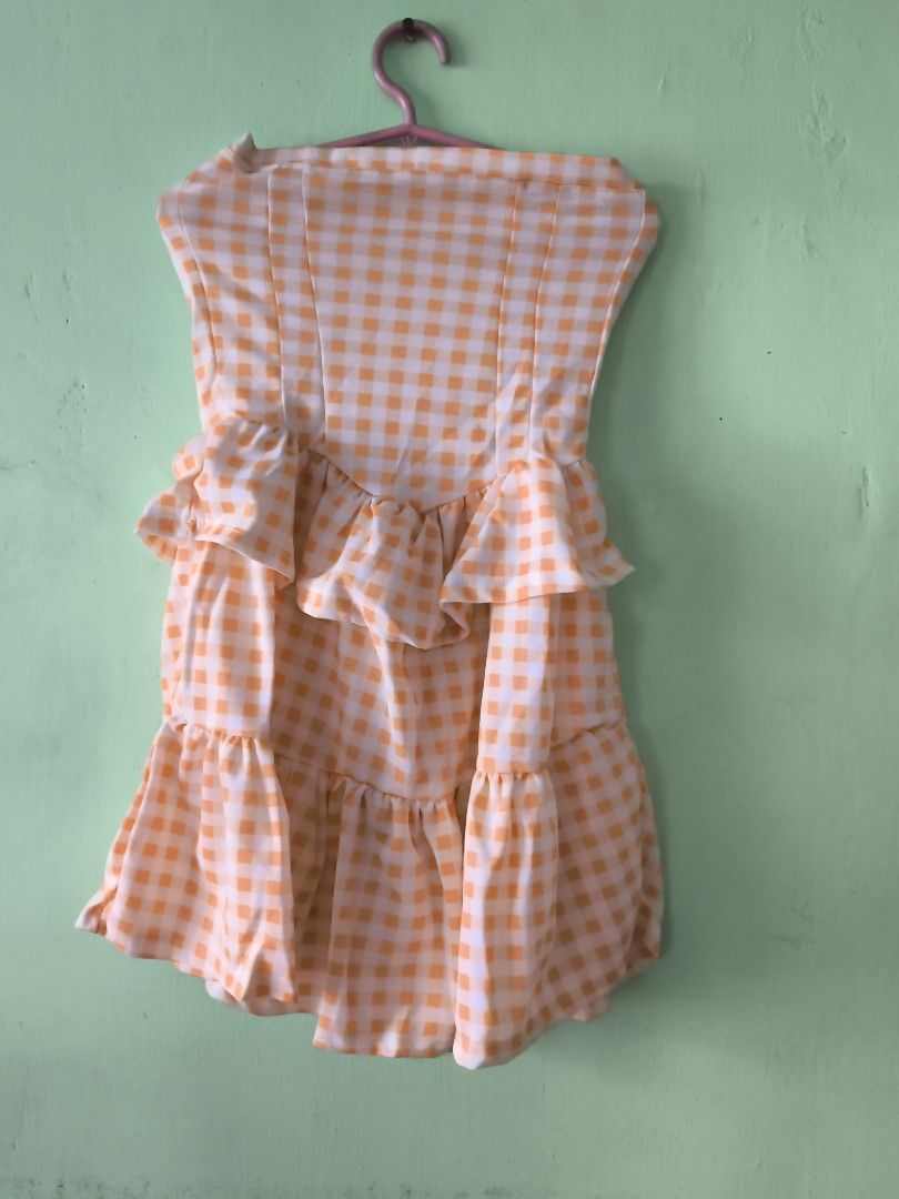 Yellow and white gingham check strapless ruffled mini dress (Category: Dresses) located in Bulacan. Submitted by jvblaguard08460 (Listing ID 1470754809, Image 1). Description: - Pattern: Yellow and white gingham check - Design: Strapless with layered ruffles on front and bottom hem - Material: Lightweight and breathable fabric, ideal for warm weather - Fit: Easy pullover style (no zippers or straps).