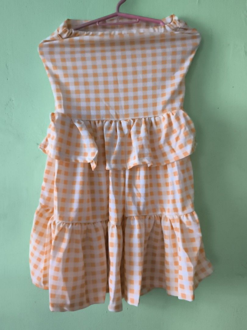 Yellow and white gingham check strapless ruffled mini dress (Category: Dresses) located in Bulacan. Submitted by jvblaguard08460 (Listing ID 1470754809, Image 2). Description: - Pattern: Yellow and white gingham check - Design: Strapless with layered ruffles on front and bottom hem - Material: Lightweight and breathable fabric, ideal for warm weather - Fit: Easy pullover style (no zippers or straps).
