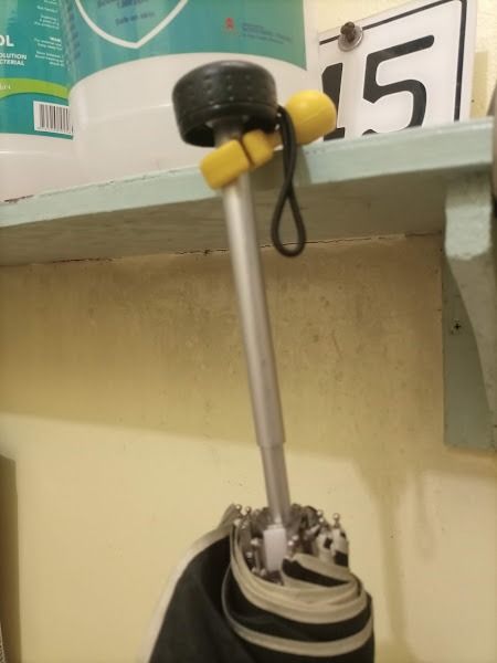 Yellow umbrella hanger holder clip hook (Category: Hooks & Hangers) located in Quezon City. Submitted by susmaryosep1 (Listing ID 1470788065, Image 2). Description: Yellow umbrella hanger holder clip hook - Color: Bright yellow - Material: Flexible silicone - Usage: Hooks onto tables, desks, and shelves - Feature: Fits various umbrella pole sizes - Benefit: Keeps umbrellas handy and off the floor - Easy to attach and remove 150.