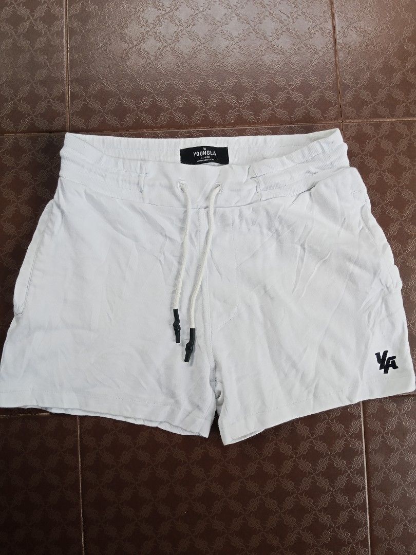 YoungLA White Shorts Model 126 XL (Category: Shorts) located in Davao. Submitted by carnopaul76938 (Listing ID 1470813367, Image 1). Description: - Brand: YoungLA - Model: 126 - Color: White - Size: Extra Large (XL) 34-36x18 - Material: Comfortable cotton - Waistband: Drawstring with black metal aglets - Details: Black embroidered logo on the left leg - Versatility: Ideal for workouts and casual wear.