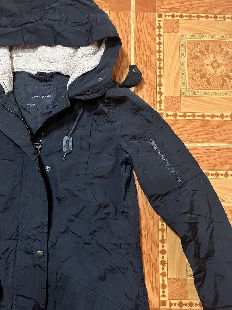 Zara Basic Black Hooded Parka Jacket Sherpa Lined (Category: Coats, Jackets and Outerwear) located in Kidapawan. Submitted by azythrift (Listing ID 1470823668, Image 2). Description: - Brand: Zara Basic small-medium 19x30 - Style: Winter Parka / Jacket - Color: Classic Black - Size: XS - Warmth: Sherpa fleece lining inside the hood - Closure: Front zip and snap button closure - Pockets: Snap-flap hip pockets, chest pocket, and a utility zipper po