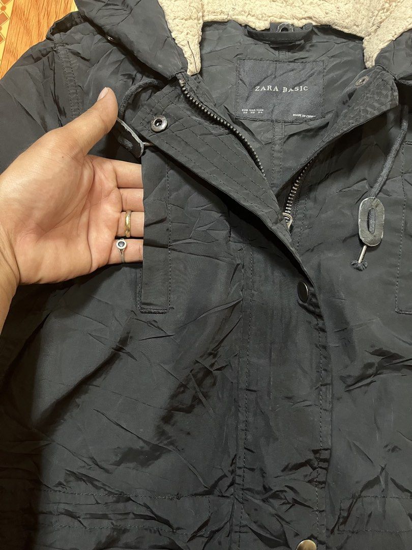Zara Basic Black Hooded Parka Jacket Sherpa Lined (Category: Coats, Jackets and Outerwear) located in Kidapawan. Submitted by azythrift (Listing ID 1470823668, Image 3). Description: - Brand: Zara Basic small-medium 19x30 - Style: Winter Parka / Jacket - Color: Classic Black - Size: XS - Warmth: Sherpa fleece lining inside the hood - Closure: Front zip and snap button closure - Pockets: Snap-flap hip pockets, chest pocket, and a utility zipper po