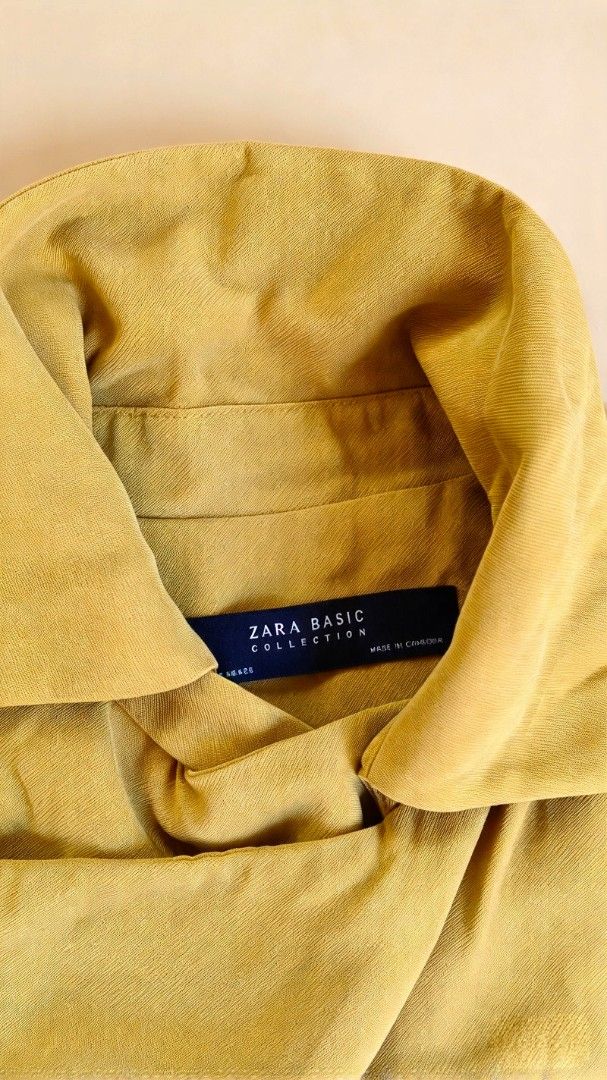 Zara Basic Collection Mustard Yellow (Category: Coats, Jackets and Outerwear) located in Batangas. Submitted by mace2014 (Listing ID 1470860687, Image 2). Description: - Brand: Zara Basic Collection - Color: Mustard Yellow - Style: jacket with asymmetrical front button closure and stand collar - Details: Shoulder epaulets, lightweight transitional fabric - Condition: Clean inside and out, ready to ship.