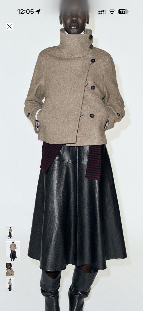 Zara Beige Wool Blend Short Coat Jacket (Category: Coats, Jackets and Outerwear) located in Cavite. Submitted by Djbstuff (Listing ID 1470899619, Image 2). Description: - Color/Material: Beige heavy warm wool blend - Style: Short cut with a structured shape - Collar: High stand-up collar with button closure - Design: Trendy asymmetric front flap with side dark buttons - Sleeves: Long sleeves with detailed cuffs - Pockets: Functional slash pockets