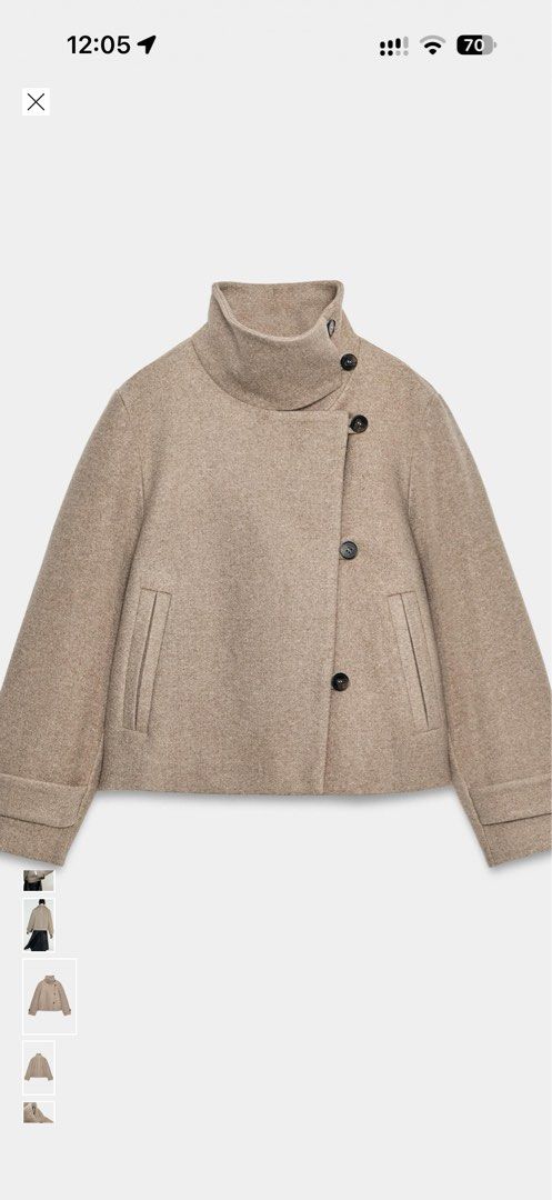 Zara Beige Wool Blend Short Coat Jacket (Category: Coats, Jackets and Outerwear) located in Cavite. Submitted by Djbstuff (Listing ID 1470899619, Image 1). Description: - Color/Material: Beige heavy warm wool blend - Style: Short cut with a structured shape - Collar: High stand-up collar with button closure - Design: Trendy asymmetric front flap with side dark buttons - Sleeves: Long sleeves with detailed cuffs - Pockets: Functional slash pockets
