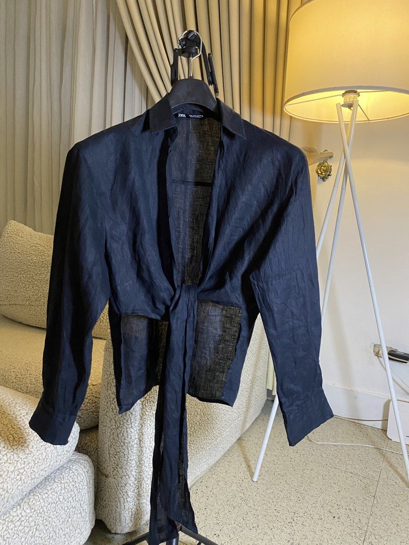 Zara Black Linen Knot Blouse Size M (Category: Blouses) located in Valencia. Submitted by negnikkah (Listing ID 1470837756, Image 2). Description: - Brand: Zara - Color: Black - Size: M - Material: Lightweight textured linen - Features: Long sleeves with structured cuffs, front tie-knot waist detail, and classic collar + SF / J&T.