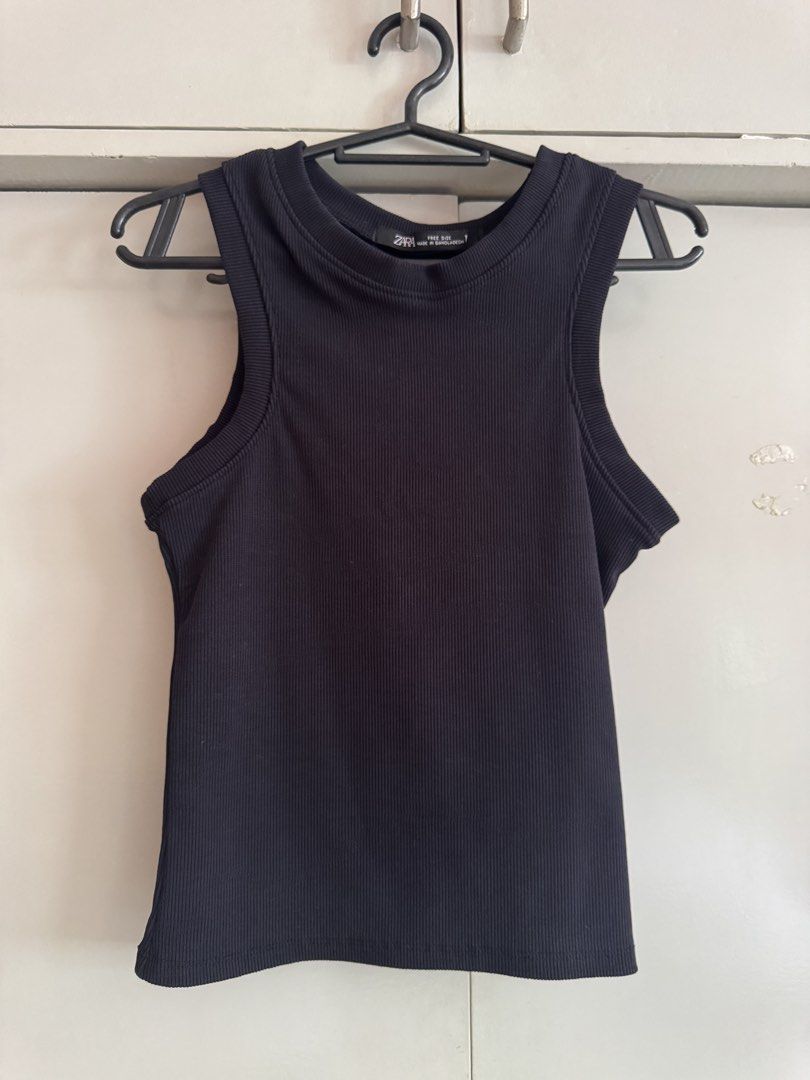 Zara Black Ribbed Tank Top Free Size (Category: Sleeveless) located in Taytay. Submitted by darkswan016 (Listing ID 1470830581, Image 1). Description: - Brand: Zara - Color: Classic Black - Style: Ribbed tank top with crew neckline and sleeveless cut - Material: Soft textured knit, very stretchy - Size: Free size (Made in Bangladesh) - Condition: Excellent, clean fabric with no flaws.
