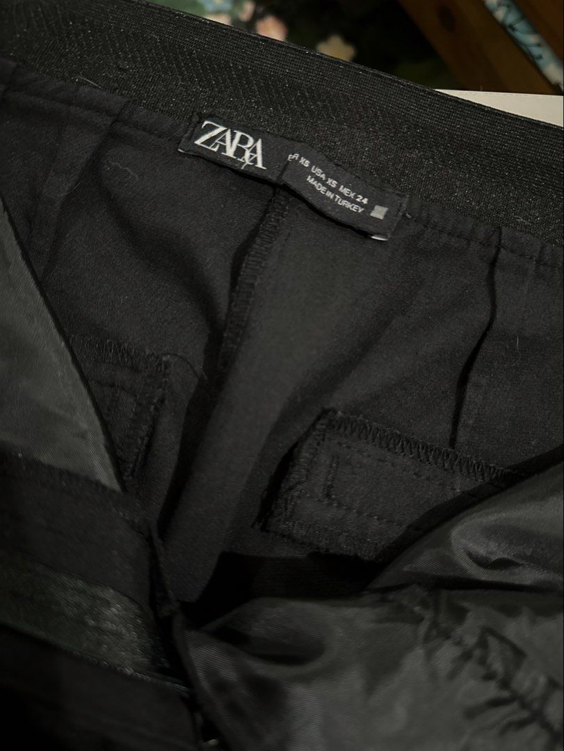 Zara Black Tailored Trousers Size XS (Category: Trousers) located in Antipolo. Submitted by wxyz9876 (Listing ID 1470879872, Image 3). Description: - Brand: Zara - Color: Black - Size: XS (fits waist 24 to 27) - Style: Clean cut silhouette with structured waistband and mock back pockets - Origin: Made in Turkey - Condition: Good, with one small smudge spot near the front thigh area.