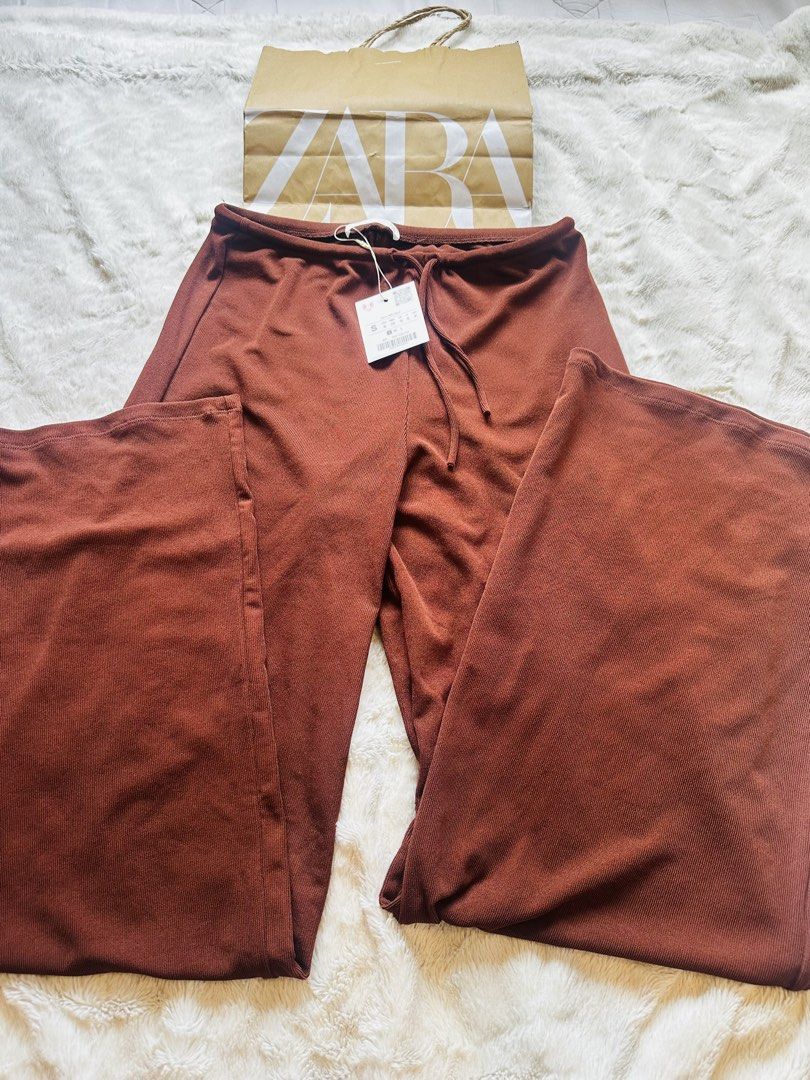 Zara Brown Wide Leg Drawstring Pants (Category: Jeans) located in Marikina City. Submitted by zarahlovestoshop (Listing ID 1470796207, Image 2). Description: - Brand: Zara - Item: Brown wide-leg trousers - Size: Small (S) - Condition: Brand new with tags (BNWT), paper bag included - Material/Design: Textured knit fabric, relaxed fit, adjustable drawstring waistband - Original Retail Price: ₱1,995 -SF c/o buyer -MOP: Bpi or Gcash only.