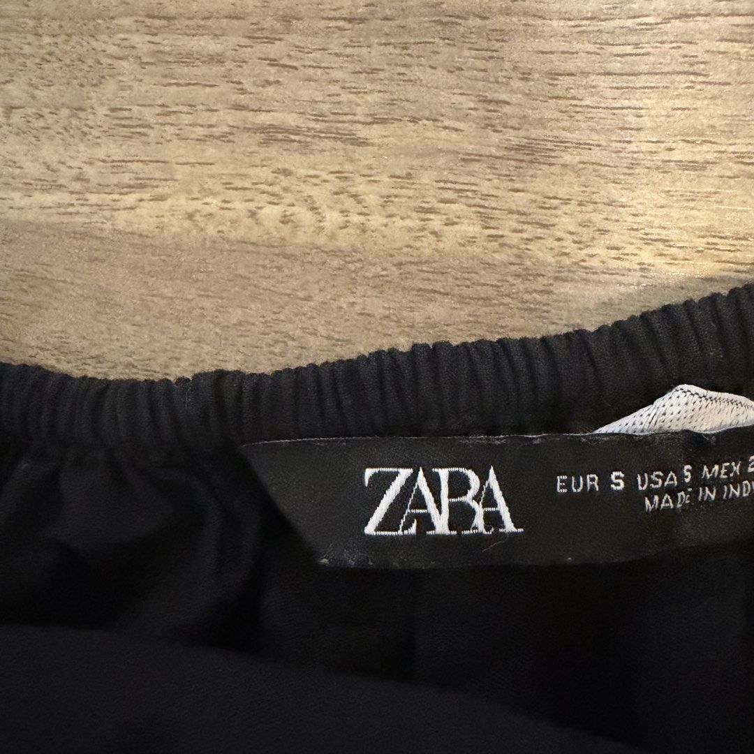 Zara Flowy Tank Black Embroidered Size S (Category: Sleeveless) located in Quezon City. Submitted by bmason0408 (Listing ID 1470827135, Image 3). Description: - Brand: Zara - Size: Small (S) - Color: Black - Details: Delicate tonal embroidery on front chest panel - Straps: Thin spaghetti straps - Hem: Flared peplum hem with subtle scalloped edges - Material: Lightweight cotton, ideal for warm weather or layering - Condition: Excellent, used twice