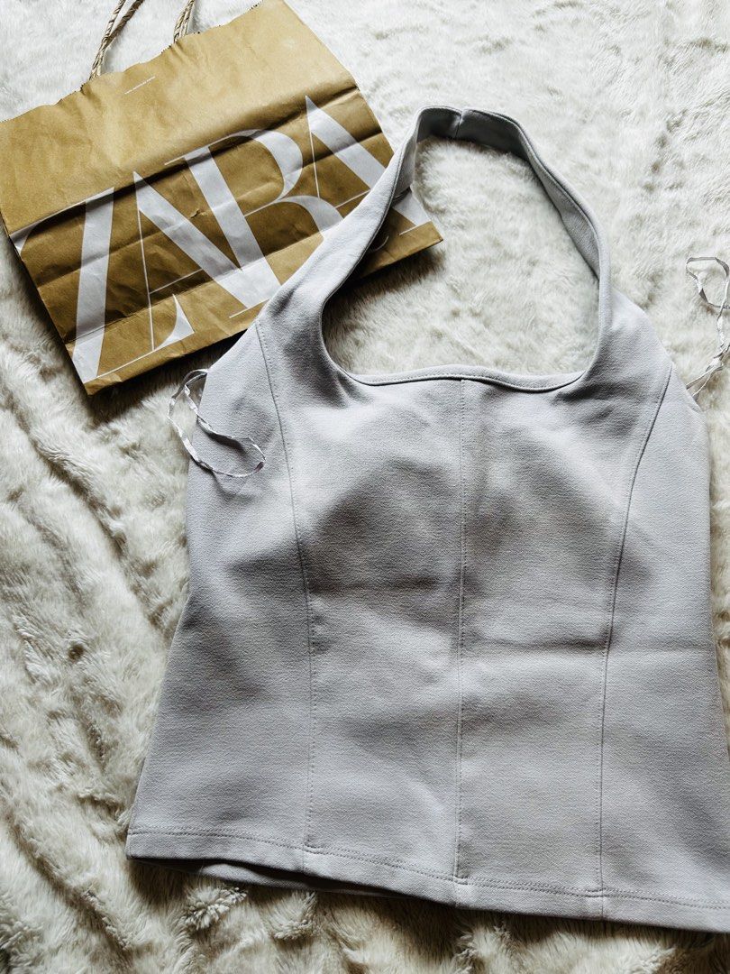 ZARA Halter Neck Top (Category: Sleeveless) located in Marikina City. Submitted by zarahlovestoshop (Listing ID 1470804394, Image 2). Description: - Brand: ZARA - Item: Halter Neck Top - Color: Light Grey - Size: M-L - Original Price: ₱1395 - Features: Square neckline, structured front panels, sleek fitted style - Styling: Great for a night out, easily pairs with trousers or skirts -Used Once -MOP: Bpi or Gcash only -SF c/o buyer.