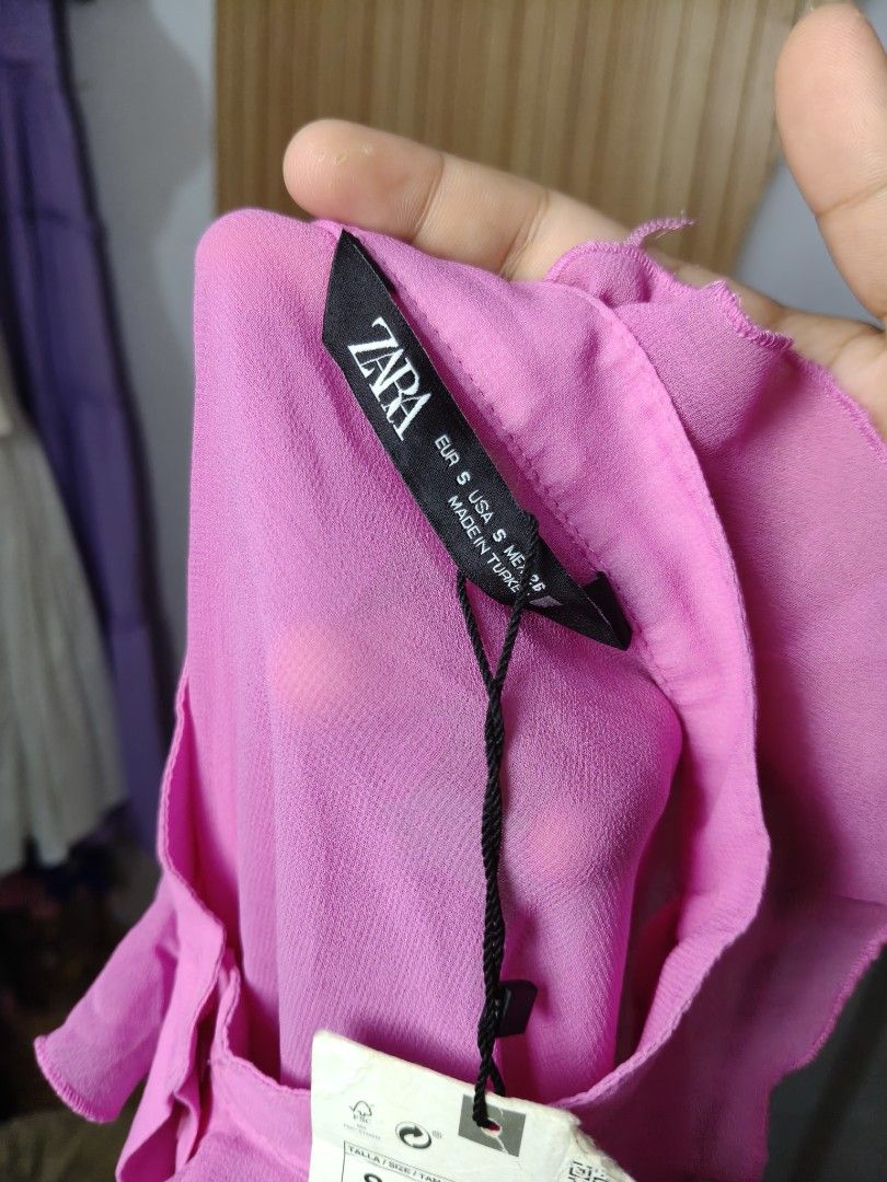 Zara Pink Ruffle Long Sleeve Blouse (Category: Longsleeves) located in Taguig. Submitted by ashie_clothing (Listing ID 1470839378, Image 3). Description: - Brand: Zara - Condition: Brand new with tags (BNWT) - Size: S - Color: Bright pink - Details: Dramatic ruffles on sleeves and collar, button-down front with a hidden placket - Origin: Made in Turkey - Perfect for work, dates, or casual chic outfits!.