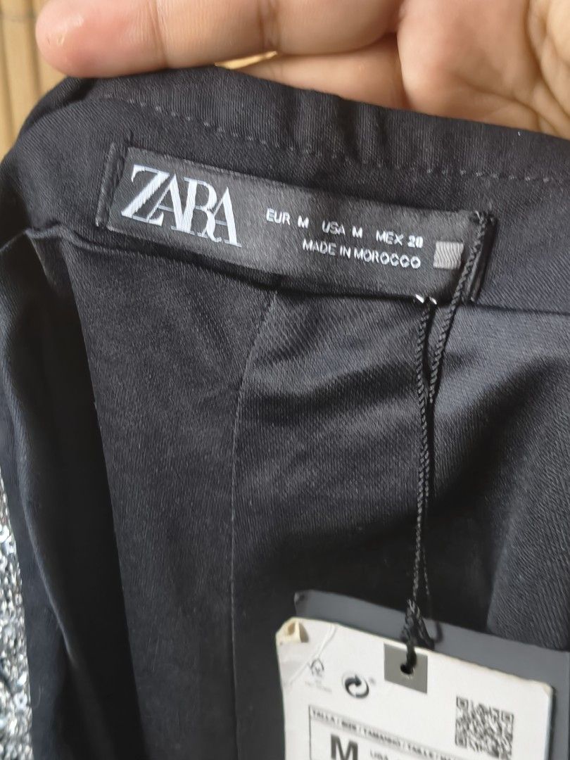 Zara Silver Sequins Shorts Size M (Category: Shorts) located in Taguig. Submitted by ashie_clothing (Listing ID 1470839420, Image 3). Description: - Brand: Zara - Size: Medium (US M, MEX 28) - Condition: Brand new with tag attached - Material/Origin: Made in Morocco - Design: Sparkly zig-zag pattern all over - Details: Black waistband and side zipper closure.