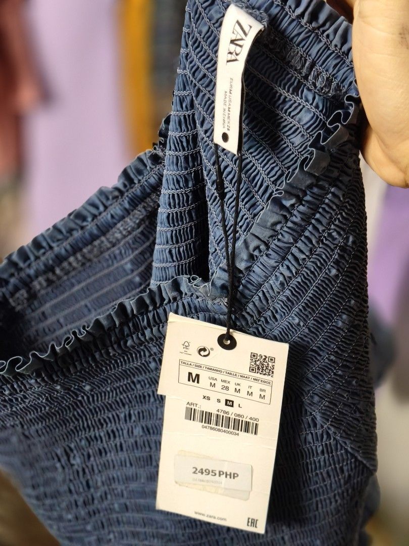 Zara Smocked Ruffle Mini Skirt Blue Size M (Category: Skirts) located in Taguig. Submitted by ashie_clothing (Listing ID 1470845464, Image 3). Description: - Brand: Zara - Style: Blue mini skirt with double-layered ruffles - Size: Medium (M) - Condition: Brand new with tags (BNWT), never worn - Waist: Smocked elastic waistband for easy stretching - Fabric: Lightweight and soft.