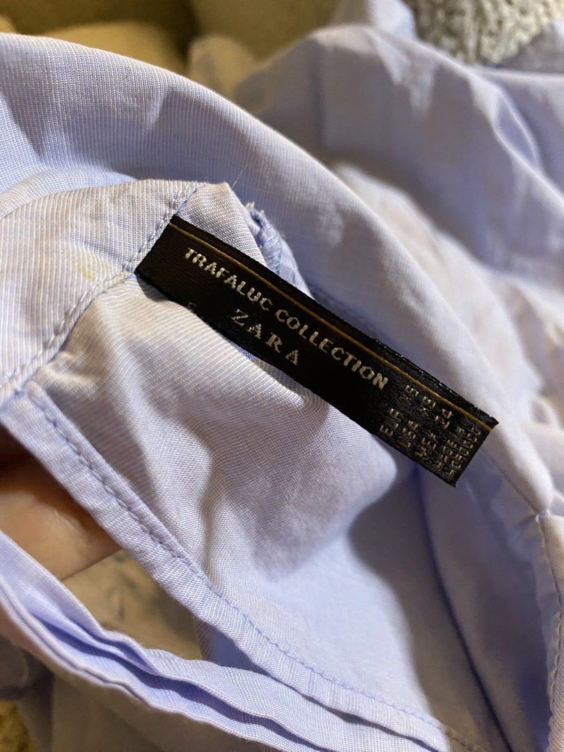 Zara Trafaluc Light Blue Ruffle Peplum Blouse (Category: Blouses) located in Valencia. Submitted by negnikkah (Listing ID 1470850945, Image 3). Description: - Brand: Zara Trafaluc - Color: Light blue - Tagged XS, but the actual fit runs large and can fit sizes up to Medium or even med- Large. Shipping fee via J&T courier will be shouldered by the buyer. - Features: Cute collared neckline, short ruffle sleeves, relaxed babydoll fit, and gathered w