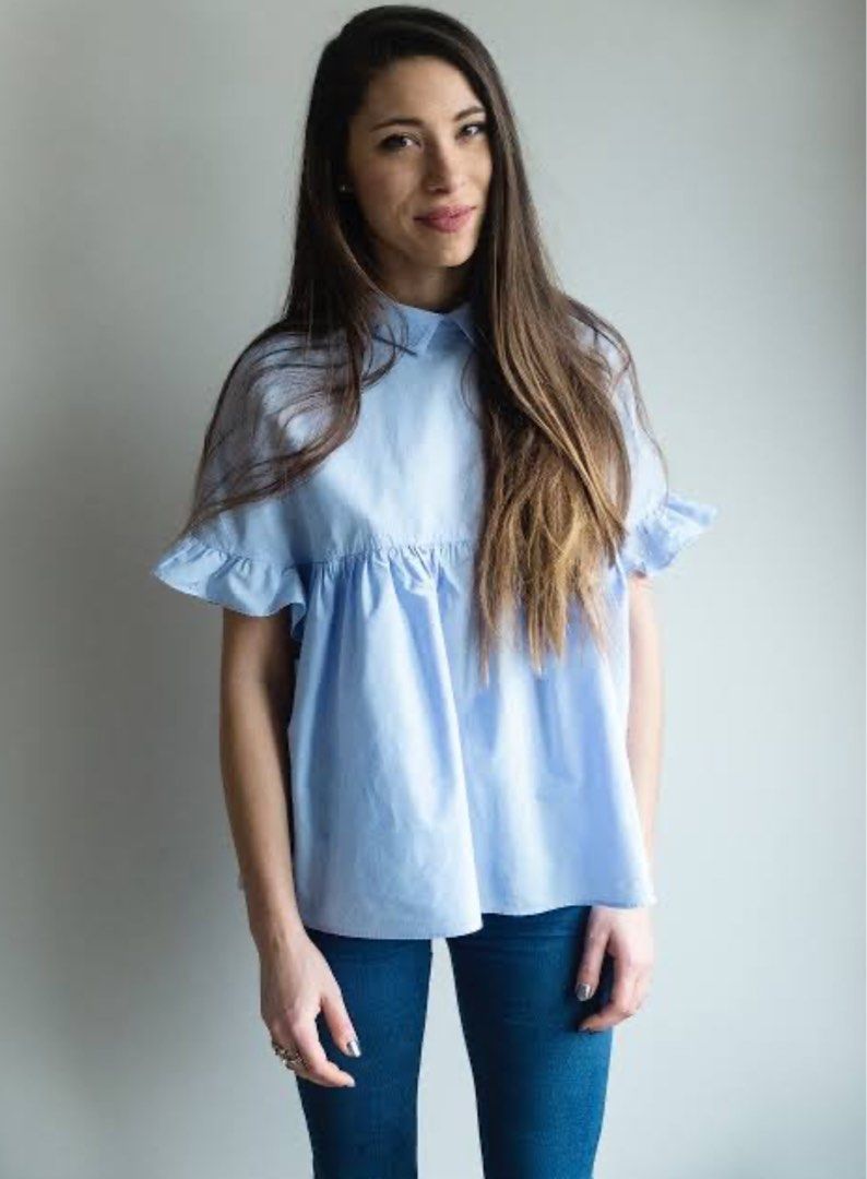 Zara Trafaluc Light Blue Ruffle Peplum Blouse (Category: Blouses) located in Valencia. Submitted by negnikkah (Listing ID 1470850945, Image 2). Description: - Brand: Zara Trafaluc - Color: Light blue - Tagged XS, but the actual fit runs large and can fit sizes up to Medium or even med- Large. Shipping fee via J&T courier will be shouldered by the buyer. - Features: Cute collared neckline, short ruffle sleeves, relaxed babydoll fit, and gathered w