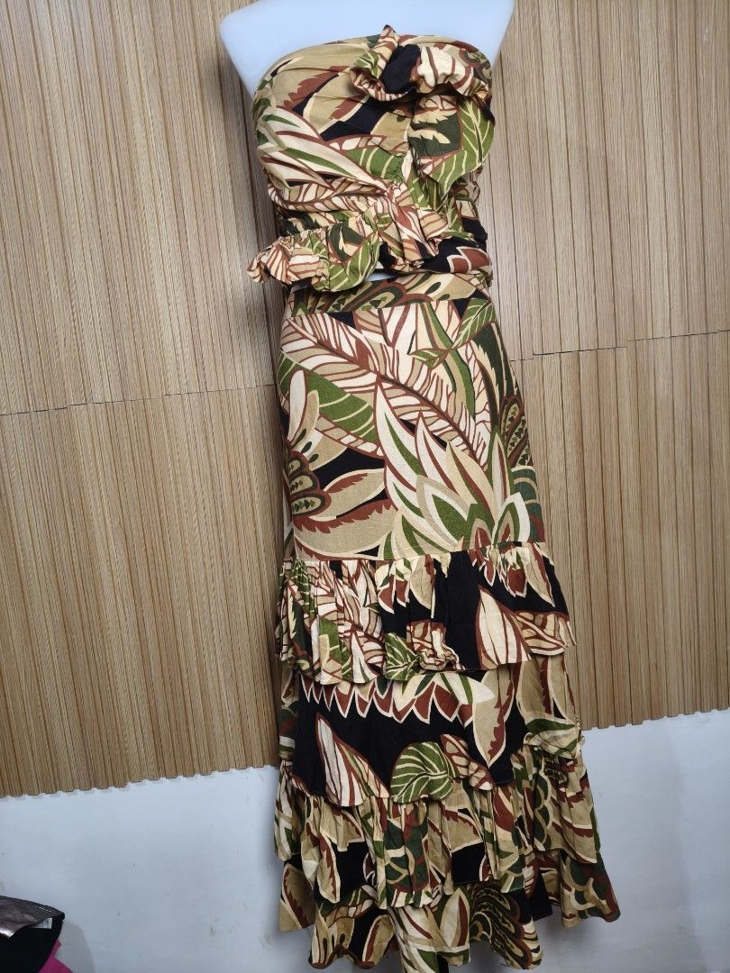 Zara Tropical Leaf Print Ruffle Two-Piece Set (Category: Sets or Coordinates) located in Taguig. Submitted by ashie_clothing (Listing ID 1470844591, Image 3). Description: - Brand: Zara - Style: Matching strapless bandeau top and long layered tiered maxi skirt set - Print/Color: Bold tropical leaf print in olive green, tan, brown, and black - Details: Ruffle accents on the top and bottom tiers - Size: XL (applies to both top and bottom) - Origin: