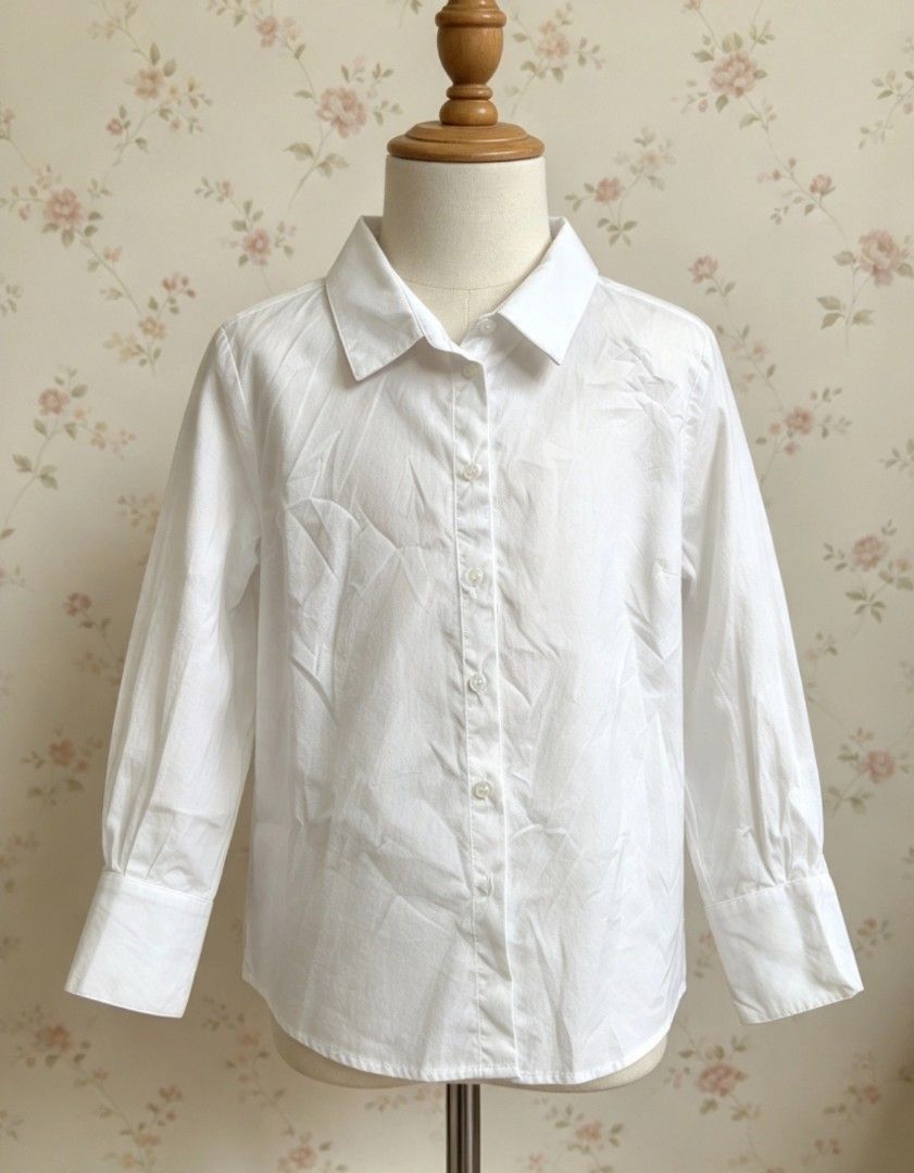 Zara White Button-Down Shirt Size L (Category: Blouses) located in Manila. Submitted by charlottej01596 (Listing ID 1470743790, Image 1). Description: - Brand: Zara - Color: White - Size: L (EUR, USA, MEX) - Origin: Made in Spain - Style: Minimalist button-down with collared neckline and long sleeves with wide cuffs - Condition/Vibe: Clean, classic staple piece, easy to style for work or casual wear.