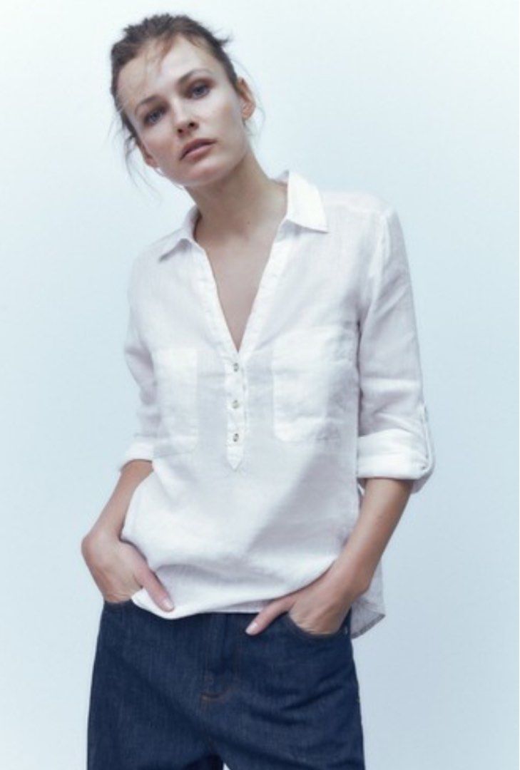 Zara White Linen Shirt Size S (Category: Shirts) located in Valencia. Submitted by negnikkah (Listing ID 1470824707, Image 3). Description: - Brand: Zara - Item: Linen Shirt - Color: Crisp White - Size: S on tag, fits small-medium - Details: V-neck with button placket, two chest pockets, long sleeves with roll-up tabs - Fabric: Lightweight and breathable - Condition: Worn a few times, very good shape, clean and ready to wear + SF /J&T .