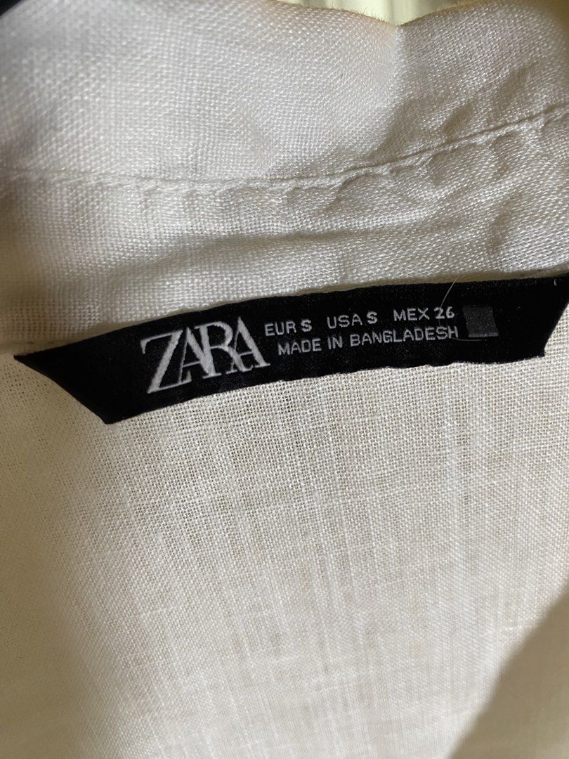 Zara White Linen Shirt Size S (Category: Shirts) located in Valencia. Submitted by negnikkah (Listing ID 1470824707, Image 2). Description: - Brand: Zara - Item: Linen Shirt - Color: Crisp White - Size: S on tag, fits small-medium - Details: V-neck with button placket, two chest pockets, long sleeves with roll-up tabs - Fabric: Lightweight and breathable - Condition: Worn a few times, very good shape, clean and ready to wear + SF /J&T .