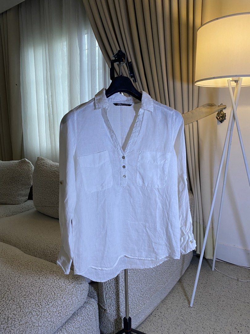 Zara White Linen Shirt Size S (Category: Shirts) located in Valencia. Submitted by negnikkah (Listing ID 1470824707, Image 1). Description: - Brand: Zara - Item: Linen Shirt - Color: Crisp White - Size: S on tag, fits small-medium - Details: V-neck with button placket, two chest pockets, long sleeves with roll-up tabs - Fabric: Lightweight and breathable - Condition: Worn a few times, very good shape, clean and ready to wear + SF /J&T .