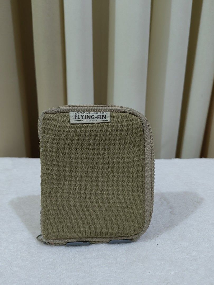 Zip Around Wallet with Card Inserts (Category: Wallets & Card holders) located in Makati City. Submitted by prelovedtreatedwithlove (Listing ID 1470898449, Image 1). Description: Brand: Flying-Fin - Closure: Secure zip-around design with sturdy YKK zippers - Material: Durable fabric - Interior Features: - Zippered coin very unique - Removable plastic card sleeves for extra storage - Condition: Excellent, well-maintained - Perfect, compact size fo