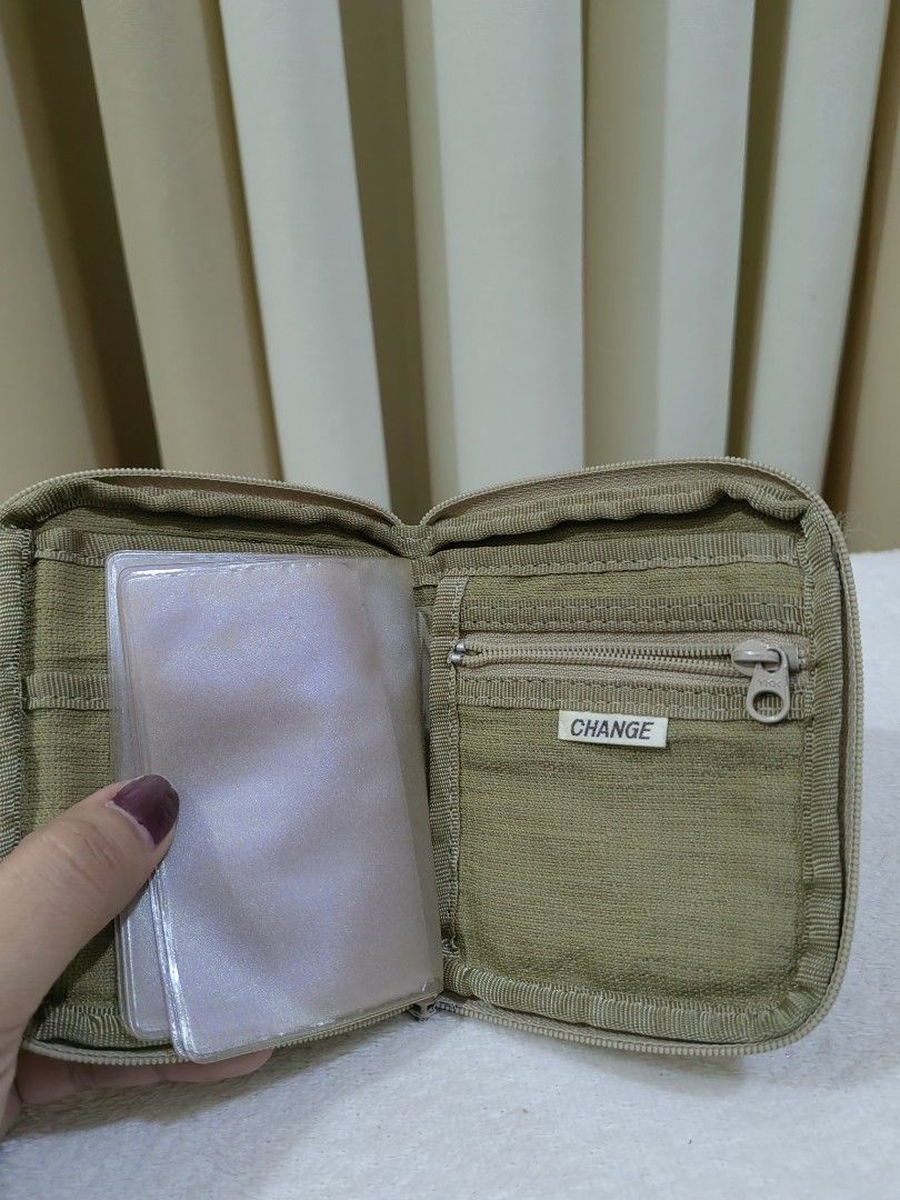 Zip Around Wallet with Card Inserts (Category: Wallets & Card holders) located in Makati City. Submitted by prelovedtreatedwithlove (Listing ID 1470898449, Image 3). Description: Brand: Flying-Fin - Closure: Secure zip-around design with sturdy YKK zippers - Material: Durable fabric - Interior Features: - Zippered coin very unique - Removable plastic card sleeves for extra storage - Condition: Excellent, well-maintained - Perfect, compact size fo