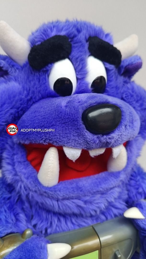 2001 Spin Master Don't Free Freddy plush (Category: Interactive Toys) located in Taguig. Submitted by adopt.my.plush.ph (Listing ID 1470963884, Image 3). Description: Don't Free Freddy purple talking monster plush toy, approx. 13 inches, released by Spin Master in 2001. *as is, untested & presumed not working *as is, rust &/or alkaline battery corrosion noted on its battery spring Key Features *Design: A fuzzy purple monster featuring white horns