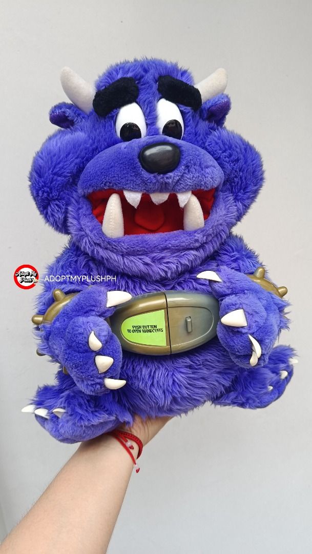 2001 Spin Master Don't Free Freddy plush (Category: Interactive Toys) located in Taguig. Submitted by adopt.my.plush.ph (Listing ID 1470963884, Image 2). Description: Don't Free Freddy purple talking monster plush toy, approx. 13 inches, released by Spin Master in 2001. *as is, untested & presumed not working *as is, rust &/or alkaline battery corrosion noted on its battery spring Key Features *Design: A fuzzy purple monster featuring white horns