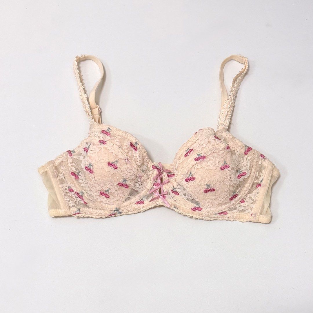 6RABBITS Cherry Embroidery Underwired Bra [34A] (Category: Undergarments & Loungewear) located in Malabon City. Submitted by k_intimates (Listing ID 1471099497, Image 2). Description: Details: • Size 34A / wired / lightly lined • Min. issue on the band (Check last photo) • Beige lace underwired bra decorated with small embroidered pink cherries and pink bow accents at the center gore..