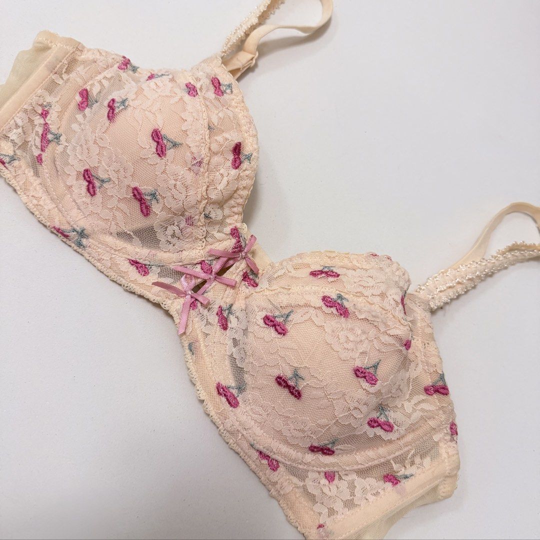 6RABBITS Cherry Embroidery Underwired Bra [34A] (Category: Undergarments & Loungewear) located in Malabon City. Submitted by k_intimates (Listing ID 1471099497, Image 3). Description: Details: • Size 34A / wired / lightly lined • Min. issue on the band (Check last photo) • Beige lace underwired bra decorated with small embroidered pink cherries and pink bow accents at the center gore..