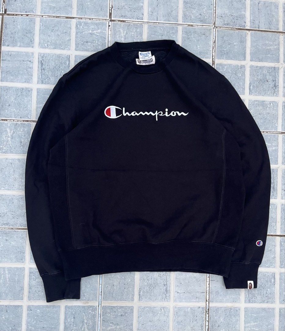 A Bathing Ape x Champion Black Reverse Weave Sweatshirt (Category: Coats, Jackets and Outerwear) located in Leyte. Submitted by odd_noodle (Listing ID 1470988224, Image 1). Description: - Brand: BAPE x Champion - Item: Reverse Weave Sweatshirt - Color: Black - Size: XL - Details: Classic Champion script logo embroidery on chest - Back Graphic: Giant A Bathing Ape head print - Accents: Collaborative woven labels at neckline and sleeve cuff - Mater