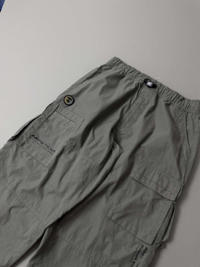 AAPE BY A BATHING APE MOONFACE TAPERED CARGO PANTS (Category: Jeans) located in Guagua. Submitted by sweetboyy (Listing ID 1471042398, Image 2). Description: AAPE BY A BATHING APE MOONFACE TAPERED CARGO PANTS EXCELLENT CONDITION SIZE SMALL ON TAG DIMES: WAISTLINE 30-32 / LENGTH 38.5 / LEG OPENING 8.