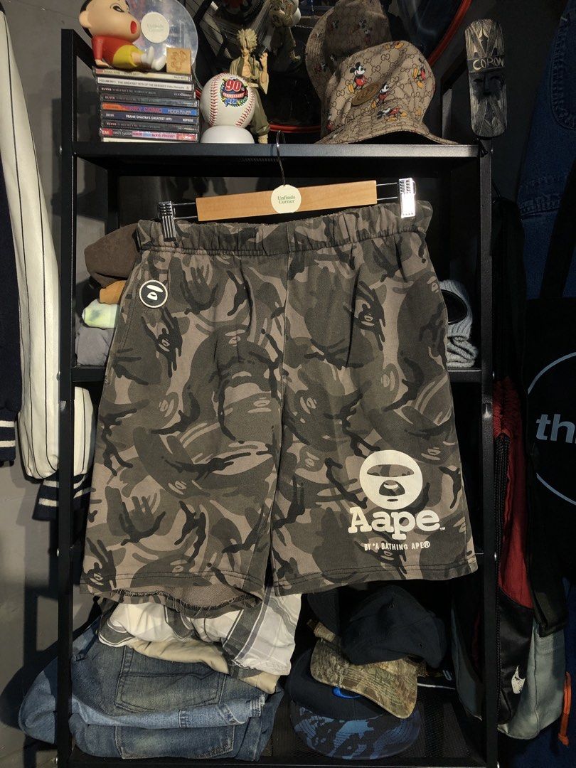 AAPE by BATHING APE CAMO SWEAT SHORTS (Category: Shorts) located in San Pablo. Submitted by genesisllo24149 (Listing ID 1471015838, Image 2). Description: AAPE by BATHING APE CAMO SWEAT SHORTS WAIST -> 28-38 LENGTH -> 18 THIGH -> 13 LEG OPENING -> 10.5 ISSUE -> REPAIRED SMALL SLICE CONDITION -> DM TO PURCHASE 📥 DISCLAIMER: - Please manage your expectations, posted items are preloved, used & thrifted -Actual color may vary due to lighting -Flaker