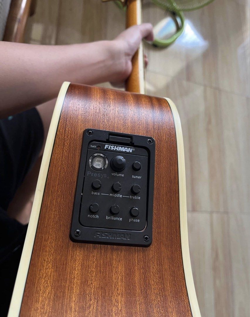 Acoustic-Electric Guitar with Fishman Preamp (Category: Musical Instruments) located in Caloocan City. Submitted by besoniajua70259 (Listing ID 1470987978, Image 2). Description: - Type: Cranberry F4141 With Fishman Pickup - Electronics: Built-in Fishman Presys+ preamp system with onboard tuner, volume, and EQ controls - Setup: Clean body and neck, fitted with 6 steel strings, ready to play - Extras included: Black shoulder strap and pick - Usage
