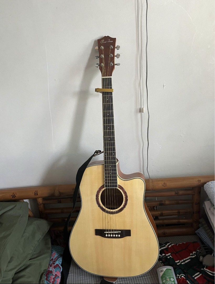 Acoustic-Electric Guitar with Fishman Preamp (Category: Musical Instruments) located in Caloocan City. Submitted by besoniajua70259 (Listing ID 1470987978, Image 1). Description: - Type: Cranberry F4141 With Fishman Pickup - Electronics: Built-in Fishman Presys+ preamp system with onboard tuner, volume, and EQ controls - Setup: Clean body and neck, fitted with 6 steel strings, ready to play - Extras included: Black shoulder strap and pick - Usage