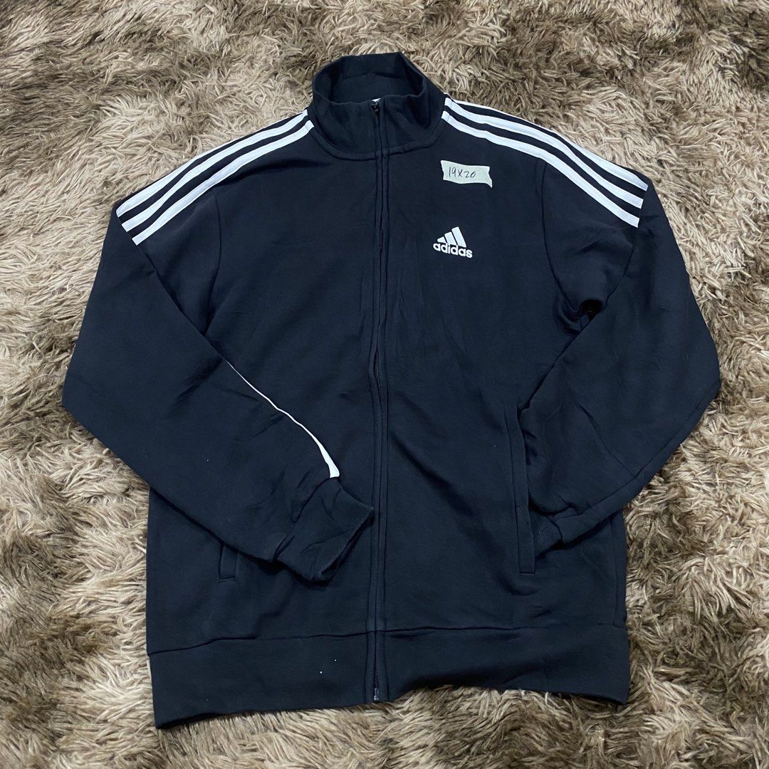 Adidas Black Track Jacket Size XS (Category: Coats, Jackets and Outerwear) located in Cagayan de Oro. Submitted by sepamorash53558 (Listing ID 1470965853, Image 1). Description: - Brand: Adidas - Color: Black with white three-stripe details - Logo: Embroidered on the chest - Features: Stand-up collar, full zip closure, side pockets - Size: A/XS (Approx. 19 inches chest, 26 inches length) - Material: Cotton and polyester blend - Origin: Made in Ch