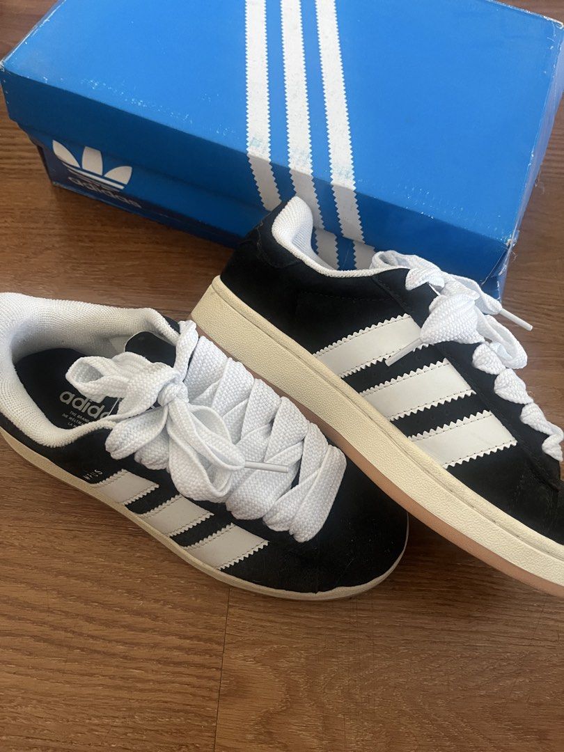 Adidas Campus Core Black White (Category: Sneakers) located in Manila. Submitted by aaa0ki (Listing ID 1470956529, Image 2). Description: - Model: Adidas Campus 00s - Colorway: Core Black and White - Size: US 6 / UK 4.5 / FR 37 1/3 / JP 230 - Material: Premium suede upper with iconic three stripes branding - Extras: Includes signature thick chunky laces - Packaging: Comes with original blue shoebox - Condition: Brand new in box.
