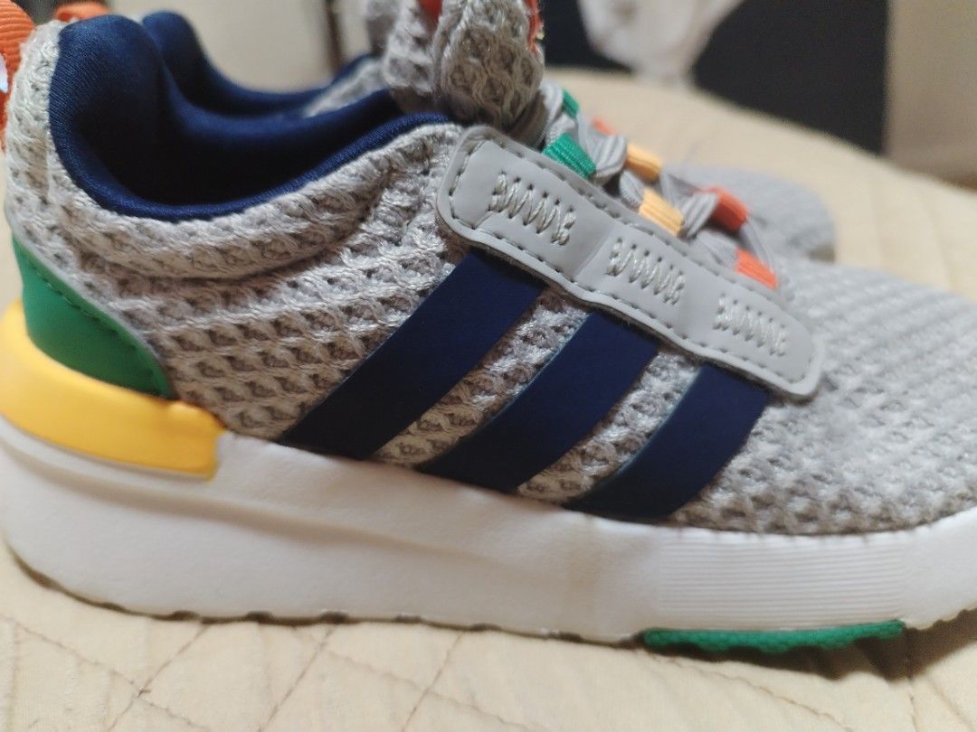 Adidas Kids Grey Sneakers (Category: Babies & Kids Fashion) located in Manila. Submitted by mrpquiamba34669 (Listing ID 1471016073, Image 3). Description: - Brand/Model: Adidas Kids Sneakers - Color: Grey mesh with navy three stripes - Details: Colourful accents on laces, heel, and pull tab - Sole: White midsole with green rubber outsole sections - Fit/Style: Slip-on design with elastic lacing system - Condition: Soles show light dirt from walkin