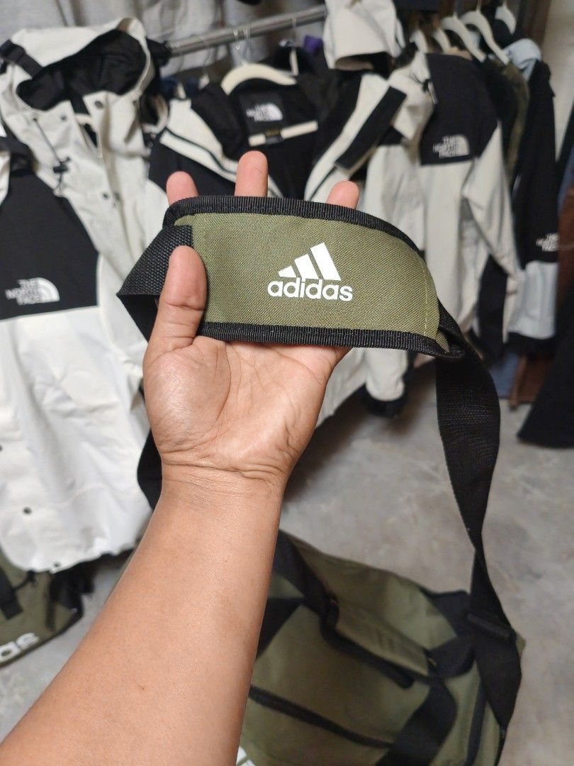 Adidas Linear Duffel Bag Small Olive Green (Category: Sling Bags) located in Manila. Submitted by ggclothings (Listing ID 1470972603, Image 3). Description: - Brand new with original tags attached (Model: H35661) - Color: Olive green with a striking white Adidas logo on the front - Size: Small, perfect for the gym, sports, or overnight trips - Comfortable carry: Dual hand straps plus a long adjustable shoulder strap with a padded cushion - Durabl