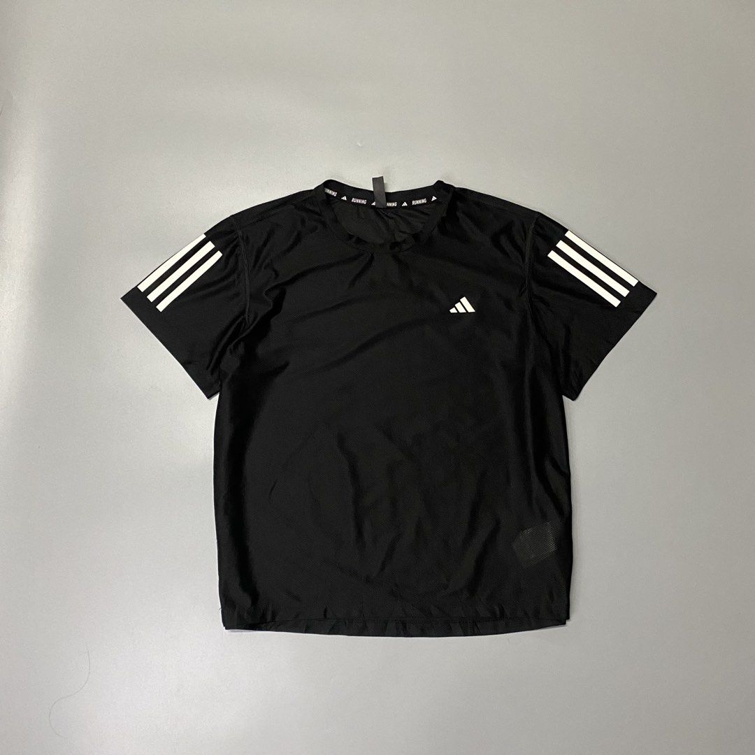 Adidas OTR Running Tee Black Size XL (Category: Activewear) located in Pagadian. Submitted by 420thriftclothes (Listing ID 1471100077, Image 1). Description: - Brand: Adidas - Color: Black - Size: XL - Material: Recycled polyester and elastane blend - Fabric: Lightweight mesh for breathability and cooling - Design: Reflective three-stripe branding on sleeves - Detail: Interior collar features printed running text tape - Origin: Made in Indonesia 