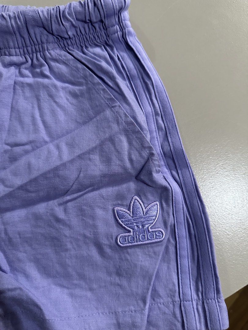 Adidas Purple Shorts (Category: Shorts) located in Antipolo. Submitted by wxyz9876 (Listing ID 1470963739, Image 2). Description: - Brand: Adidas - Color: Light purple - Size: Asia D 32 (best fits XS to M) - Features: Elastic waistband with adjustable drawstring, practical side pockets, and embroidered trefoil logo - Condition/Vibe: Great casual piece for lounging, workouts, or running errands SUPER CUTE!!.