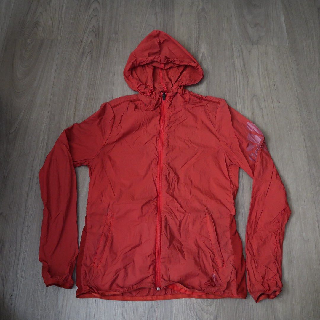 Adidas Red Hooded Windbreaker Jacket Size S (Category: Coats, Jackets and Outerwear) located in Manila. Submitted by mixi_lexi (Listing ID 1471038528, Image 1). Description: - Brand: Adidas - Color: Bright red - Size: S - Material: Lightweight windbreaker fabric - Features: Full zip front, front hand pockets, drawstring hood - Details: Iconic Adidas logo printed near the bottom hem and on the sleeve - Origin: Made in China - Condition: Excellent.