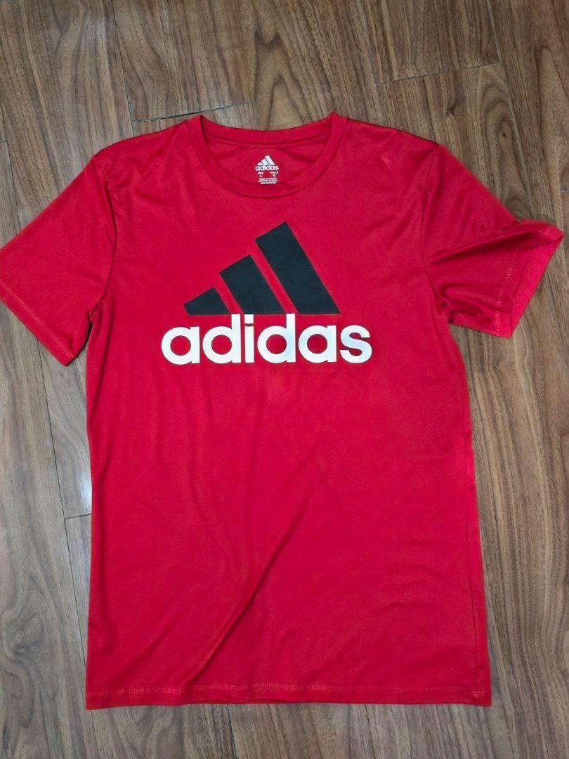 Adidas Red T-Shirt with Large Logo Size L (Category: Tshirts & Polo Shirts ) located in Manila. Submitted by zmpnsln (Listing ID 1471075430, Image 1). Description: Adidas Red Big Logo Athletic T-Shirt – Men's L Asking Price: ₱349 (Negotiable) - Brand: Adidas - Size: Men's Large (L) - Color: Bright Red - Style: Athletic / Casual T-Shirt - Neckline: Crewneck - Sleeves: Short Sleeves - Design: Large Black Adidas Three-Bar Logo with White Adidas Word
