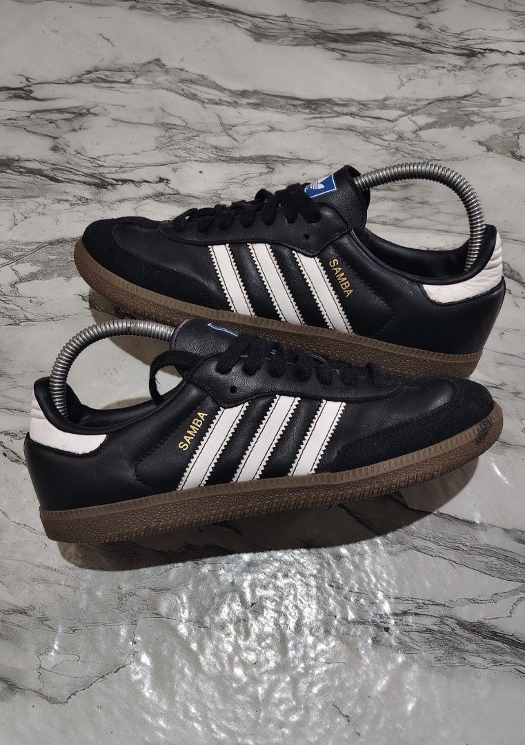 Adidas Samba Black White Size US 6.5 (Category: Sneakers) located in Inabanga. Submitted by once.twice (Listing ID 1470959150, Image 1). Description: - Brand: Adidas Samba - Color: Black and white with gum soles and gold lettering - Details: Blue trefoil logo patch on the tongue - Size: US 6.5, UK 6, FR 39 1/3 - Condition: Clean outsoles, great traction, ready to wear.