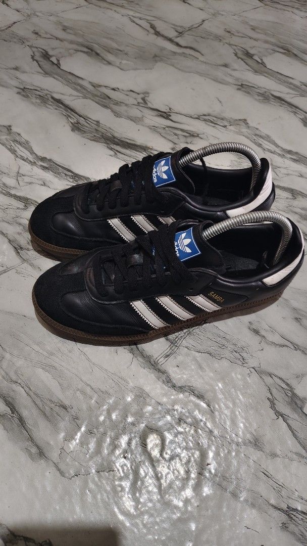 Adidas Samba Black White Size US 6.5 (Category: Sneakers) located in Inabanga. Submitted by once.twice (Listing ID 1470959150, Image 3). Description: - Brand: Adidas Samba - Color: Black and white with gum soles and gold lettering - Details: Blue trefoil logo patch on the tongue - Size: US 6.5, UK 6, FR 39 1/3 - Condition: Clean outsoles, great traction, ready to wear.