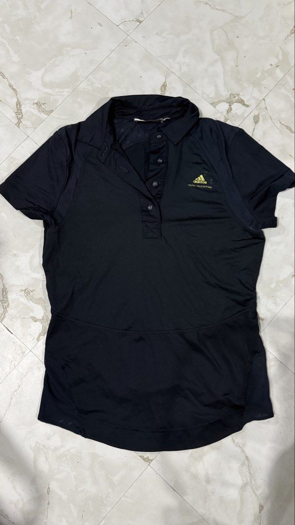 Adidas x Stella McCartney Drifit Polo (Category: Shirts) located in Quezon City. Submitted by dinesaur (Listing ID 1471075789, Image 1). Description: With pin hole sa baba, see 3rd pic (sumabit somewhere And brand logo transfer onti sa chest.